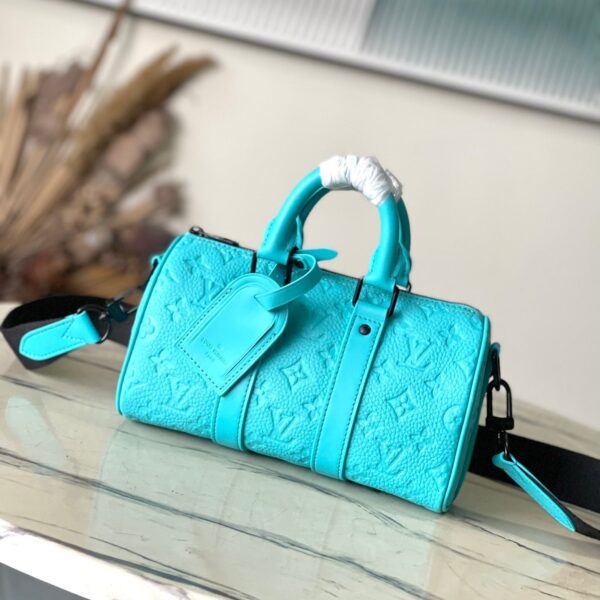 KEEPALL BANDOULIRE 25 IN TURQUOISE BLUE MONOGRAM EMBOSSED CALFSKIN